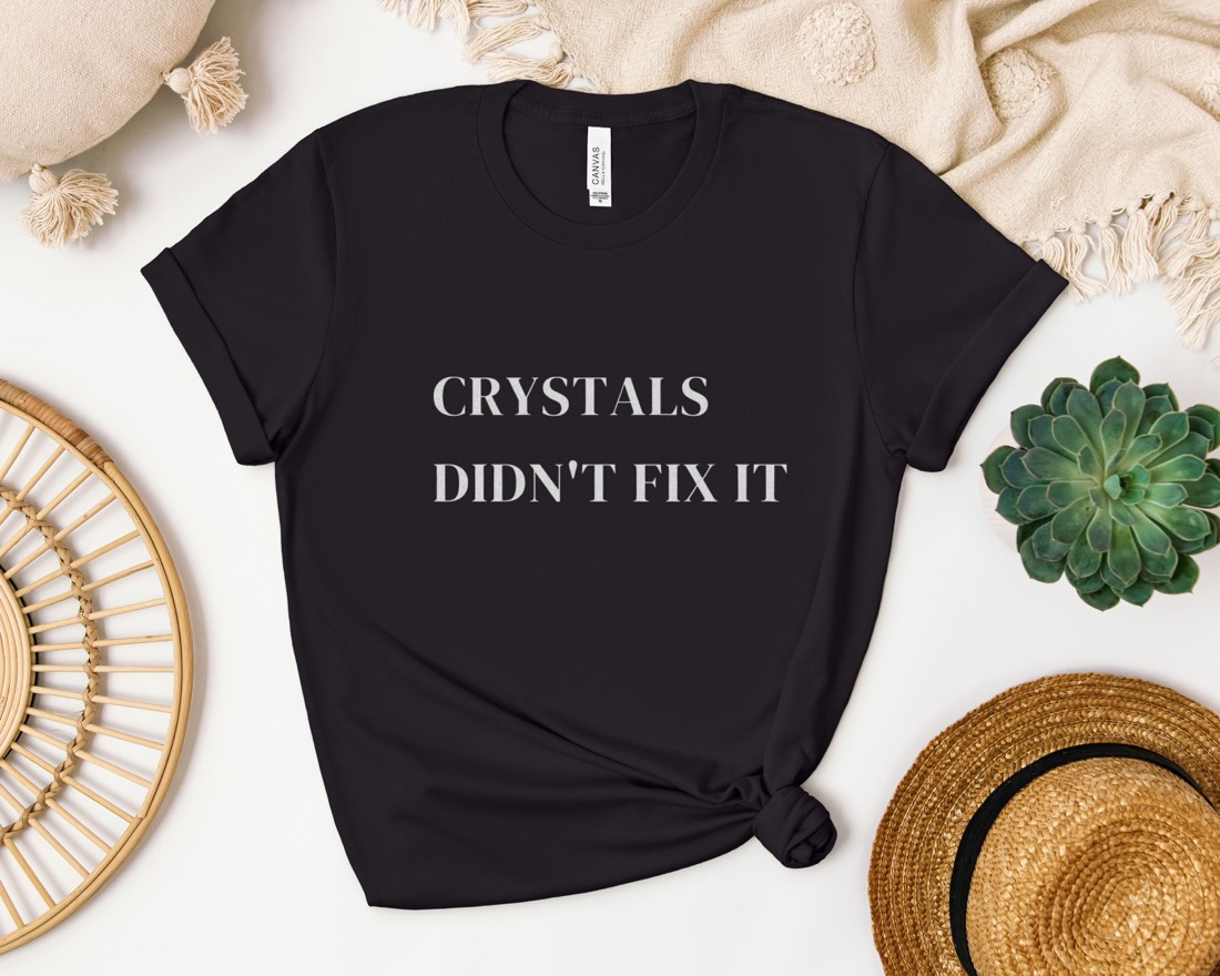 Black Crystals Didn't Fix It tee laid flat with styled props